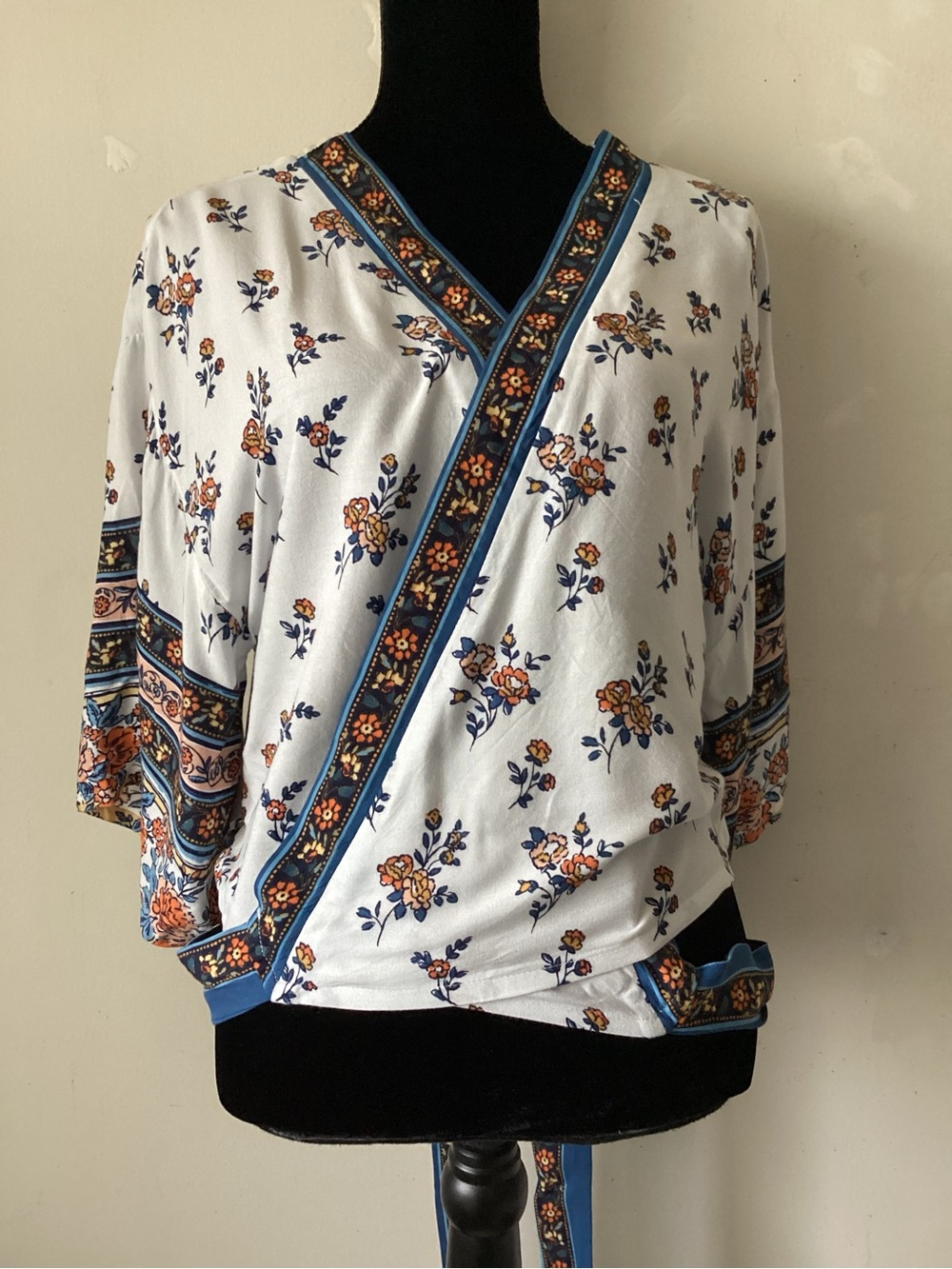 Japna floral Wrap-Style Women's Top in White and Blue. Attached belt.